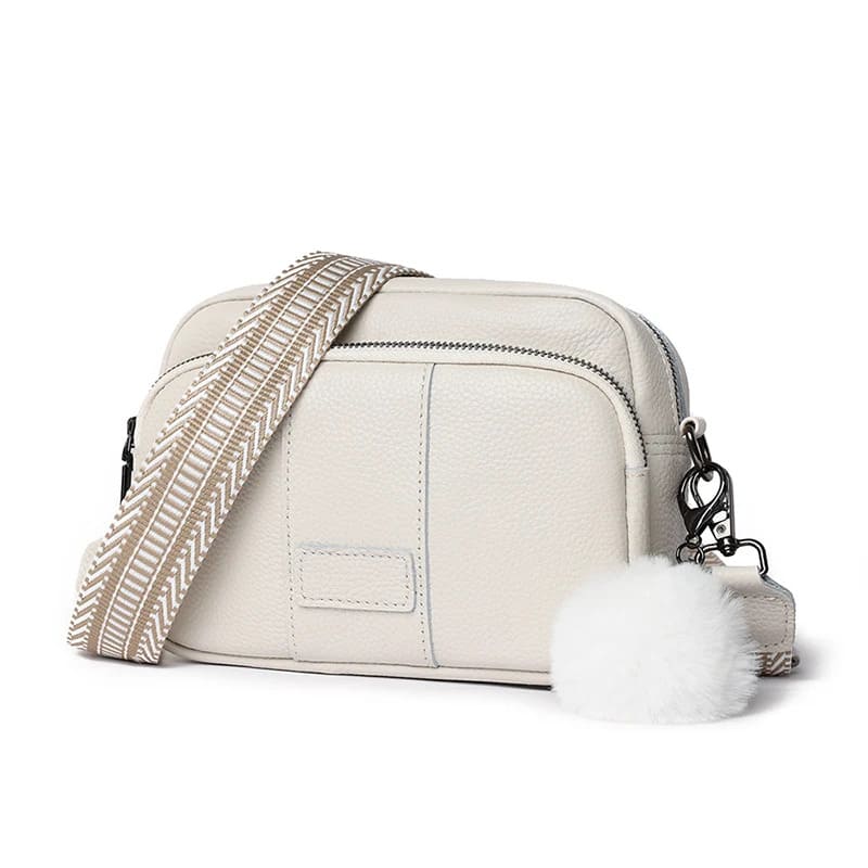 sac banane femme chic en cuir pompon